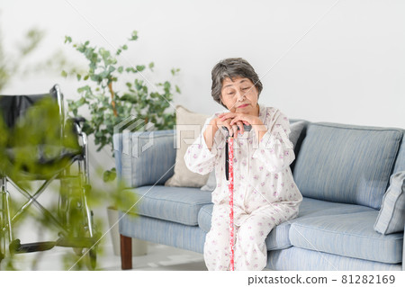 Senior woman wand worried sofa 81282169