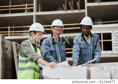 Group of Engineers Discussing Construction Plans 81284677