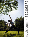 Lady fitness trainer stretching outdoors. 81286272