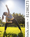 Lady fitness trainer stretching outdoors. 81286273