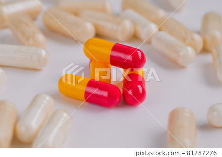 Pills, tablets, drugs, meds, medications on white surface - close up Pills, tablets, drugs, meds, medications on white surface - close up 81287276