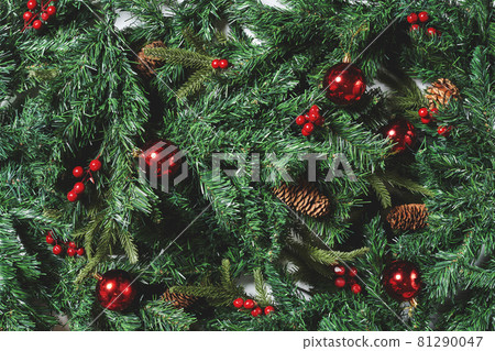 Full frame shot of Christmas tree branches and Xmas decorations. Top view. Fir tree, pine cones and Christmas baubles Full frame shot of Christmas tree branches and Xmas decorations. Top view. Fir tree, pine cones and Christmas baubles 81290047
