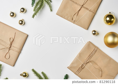 Preparing Christmas gifts with craft paper at home. Homemade Christmas presents. Bright Christmas background with colorful Xmas decorations Preparing Christmas gifts with craft paper at home. Homemade Christmas presents. Bright Christmas background with colorful Xmas decorations 81290118