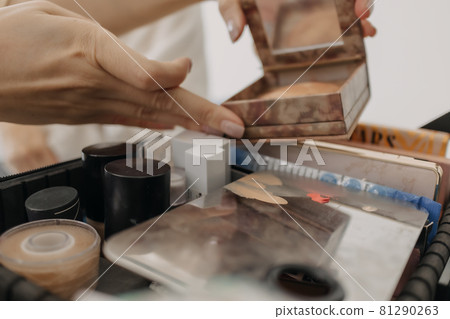 Makeup artist is using makeup tools applying to the client. 81290263