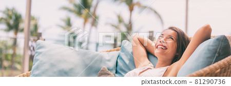 Lifestyle relax happy Asian woman on sofa luxury hotel living banner panoramic. Comfort home summer travel vacation free girl breathing clean air on summer destination panorama 81290736