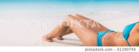 Summer beach bikini body woman lying on white sand sun tanning smooth legs sun tan for laser hair removal concept banner panoramic background 81290749