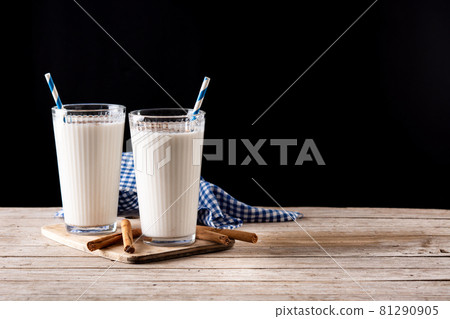 Fresh horchata with cinnamon in glass Fresh horchata with cinnamon in glass 81290905