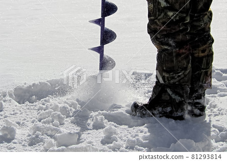 Side View of Drilling a Hole for Ice Fishing 81293814