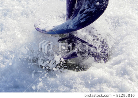 Closeup View of a Ice Fishing Hole Being Drilled Closeup View of a Ice Fishing Hole Being Drilled 81293816