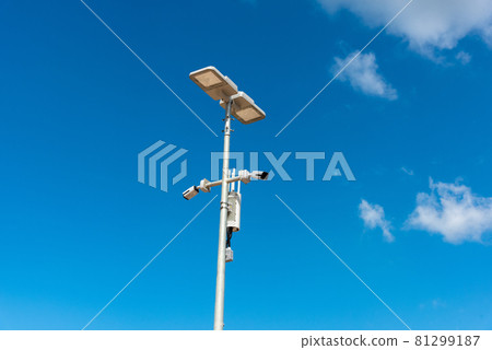 CCTV camera with blue sky background. Close-up of outdoor surveillance cameras on a street pole, Ensuring security on the street.. CCTV camera with blue sky background. Close-up of outdoor surveillance cameras on a street pole, Ensuring security on the street.. 81299187