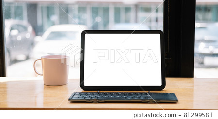 Shot of digital tablet with blank white screen, keyboard, cup of coffee on workspace desk Shot of digital tablet with blank white screen, keyboard, cup of coffee on workspace desk 81299581