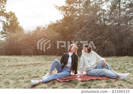 two happy girls smiling. Portrait of women hugging. The concept of relationships in the family, friends, sisters, couple in love 81300535
