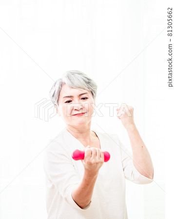 Healthy lifestyle. Smiling Asia mature female layperson powder red bell training 81305662