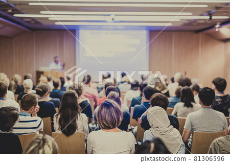 Audience in lecture hall on scientific conference. 81306596