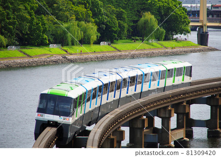 Tokyo Monorail running on the Keihin Canal against the backdrop of Ryokudo Park Tokyo Monorail running on the Keihin Canal against the backdrop of Ryokudo Park 81309420
