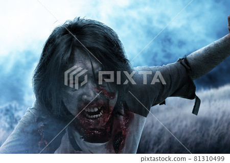 Scary zombie with blood and wound on his body crawling 81310499