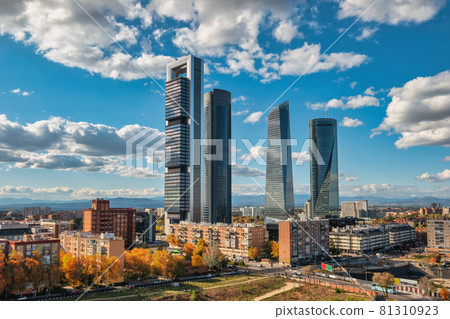 Madrid Spain, city skyline at financial district four towers with autumn foliage season Madrid Spain, city skyline at financial district four towers with autumn foliage season 81310923