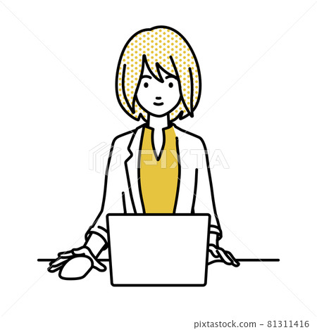 A woman in a jacket sitting at a desk and using a PC A woman in a jacket sitting at a desk and using a PC 81311416