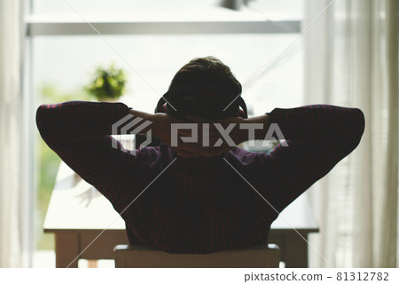 Programmer Listening to Music in Headphones 81312782