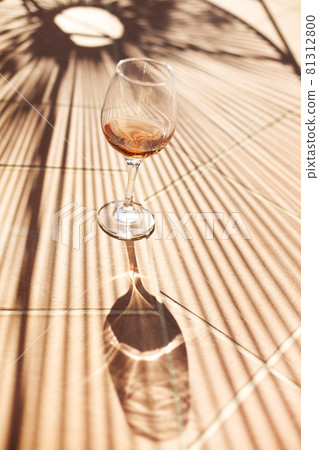 Wineglass on brick border in yard 81312800