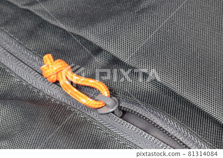 Closeup of zipper in sport bag. Zipper with multi color. textile accessories material zipper metal macro. Closeup of zipper in sport bag. Zipper with multi color. textile accessories material zipper metal macro. 81314084