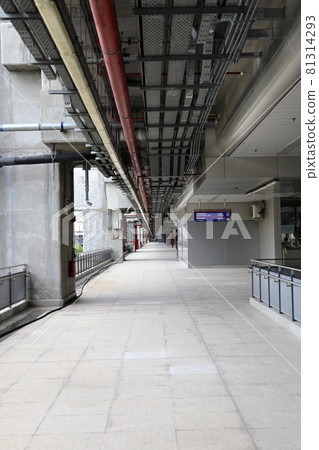 Pedestrian pathway or corridor or hallway between train station and airport building. Pedestrian pathway or corridor or hallway between train station and airport building. 81314293