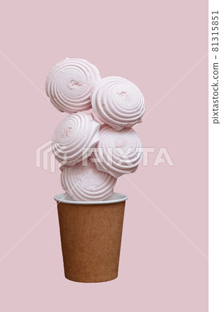 Homemade marshmallows in a paper cup isolated on pink background Homemade marshmallows in a paper cup isolated on pink background 81315851
