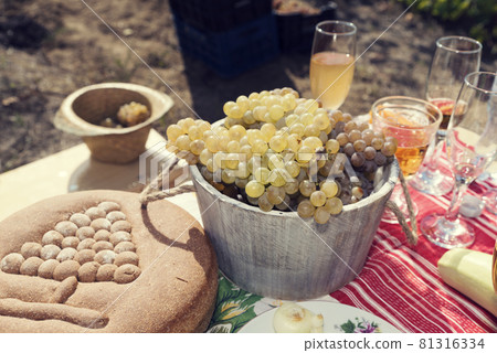 Picnic in vineyard. Harvesting feast. Selective focus 81316334