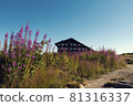 BULGARIA, PIRIN NATIONAL PARK, BANSKO, SEPTEMBER 7, 2020: Landscape view of Bezbog hut and beautiful pink alpine flowers in National park Pirin Focus on the building 81316337