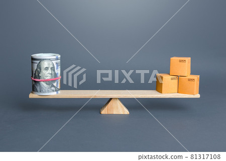 Dollars bundle and boxes on scales. Trade balance and purchasing power. Commerce and business. Trade of goods and services. Foreign money exchange inflow into the country, economic growth, enrichment. Dollars bundle and boxes on scales. Trade balance and purchasing power. Commerce and business. Trade of goods and services. Foreign money exchange inflow into the country, economic growth, enrichment. 81317108