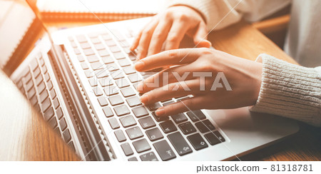 Young woman working in home on her laptop computer. 81318781