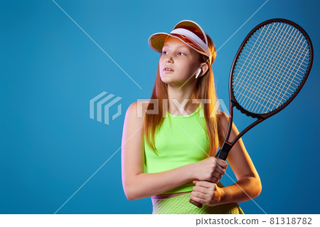 girl teenager with racket in sporswear and hat 81318782