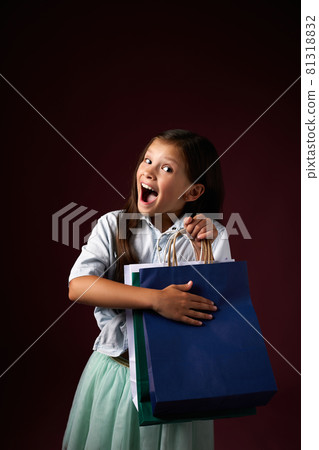 happy little child girl holds many shopping bags happy little child girl holds many shopping bags 81318832