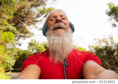 Bearded senior using mobile phone outdoor Bearded senior using mobile phone outdoor 81318901