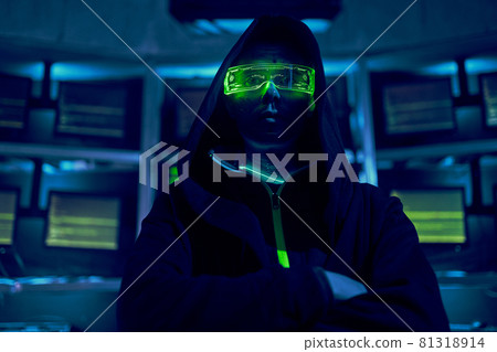 Portrait of a cyber hacker stealing information using a computer. Portrait of a cyber hacker stealing information using a computer. 81318914