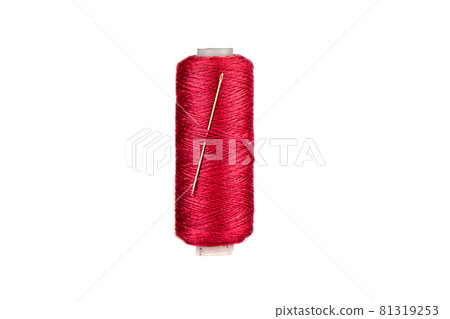 A Needle Stuck In A Spool Of Thread Stock Photo - Download Image