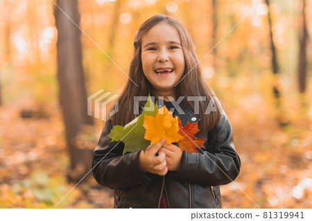 Autumn portrait of cute little asian girl. Children, fall and season concept. 81319941