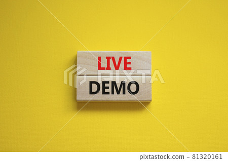 Live demo symbol. Concept words 'live demo' on wooden blocks on a beautiful yellow background. Copy space. Business and live demo concept. 81320161