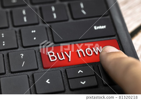 Closeup of finger on red computer keyboard key with the text Buy now in white Letters, Online shopping, technology and sale concept Closeup of finger on red computer keyboard key with the text Buy now in white Letters, Online shopping, technology and sale concept 81320218