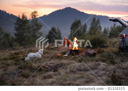 Woman at picnic in the mountains Woman at picnic in the mountains 81320315