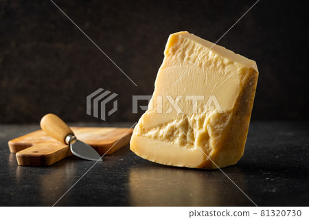 Block of italian parmesan cheese. 81320730