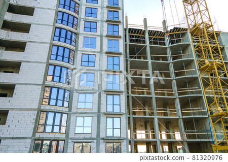 Aerial view of high residential apartment building under construction. Real estate development. Aerial view of high residential apartment building under construction. Real estate development. 81320976