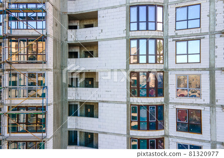 Aerial view of high residential apartment building under construction. Real estate development. Aerial view of high residential apartment building under construction. Real estate development. 81320977
