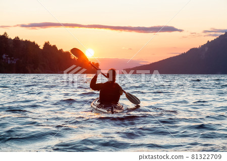 Adventurous Woman on Sea Kayak paddling in the Pacific Ocean Adventurous Woman on Sea Kayak paddling in the Pacific Ocean 81322709