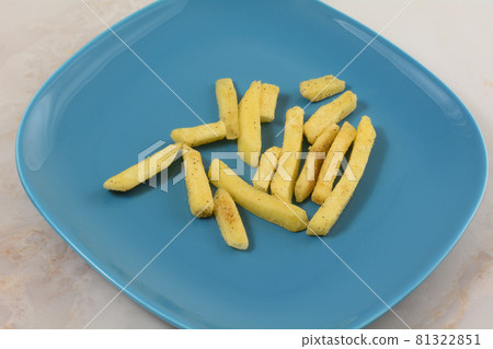 Black truffle potato fries on blue snack plate on table Black truffle potato fries on blue snack plate on table 81322851