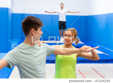 Teenager preparing to trampoline training Teenager preparing to trampoline training 81324295
