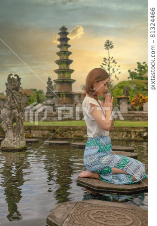 Woman praying in Bali Woman praying in Bali 81324466