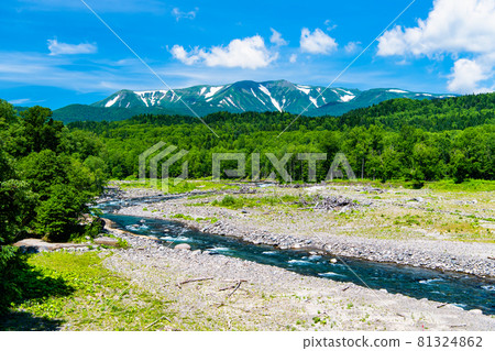Daisetsuzan and Ishikari River with residual snow in Hokkaido Daisetsuzan and Ishikari River with residual snow in Hokkaido 81324862