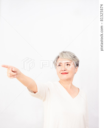 Hands pointing forward for mature Asian women with gray hair. Hands pointing forward for mature Asian women with gray hair. 81325874