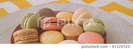 Macaroons dessert plate panoramic banner. Pastel colors macarons selection at home 81326520